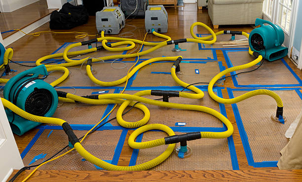 Professional Flood Damage Restoration technician working in Coos Bay, OR